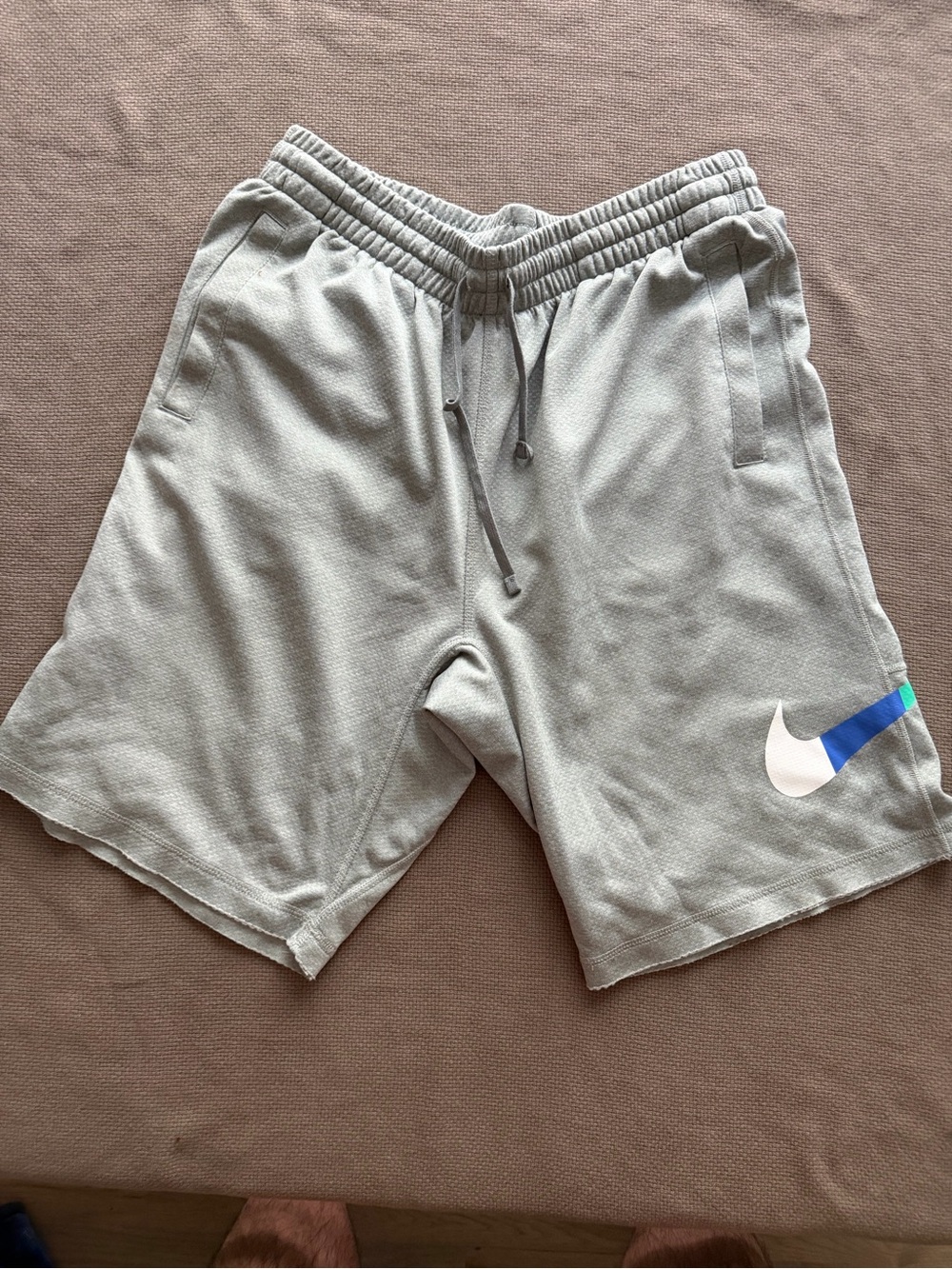 Nike Men’s Light Gray Athletic Shorts with White Swoosh and Blue Accent
